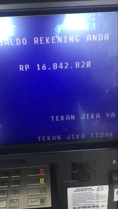 an atm machine with a blue screen on it's front and the words, sarlo rekening anda