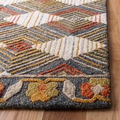 a multicolored area rug on the floor