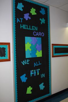 a blackboard with puzzle pieces on it that says at hellen caro we all fit in