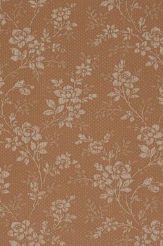 a brown wallpaper with white flowers and polka dots on the bottom half of it