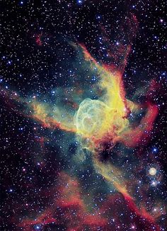 an image of a star in the sky with many stars around it and some bright colors