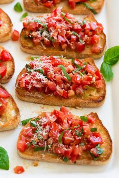 toasted bread topped with tomatoes and basil