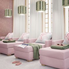 a living room filled with pink couches and pillows on top of it's sides