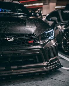 the front end of a black subarunt car