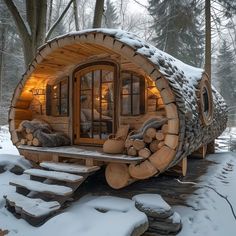 a log cabin is built into the snow