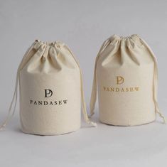 two drawsew bags sitting next to each other on a white surface with the word pandasew printed on it