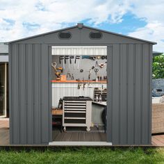 an outdoor storage shed with tools in it