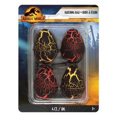 four black eggs with lightning designs on them in a plastic package for halloween or any other occasion