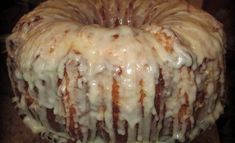 a bundt cake covered in icing and drizzled