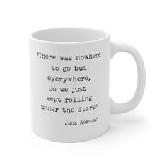 a white coffee mug with the quote, there was nowhere to go but everywhere, so we just kept rolling under the stars