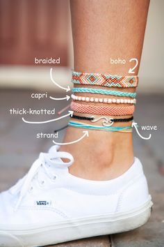 a woman's feet with different types of bracelets on them