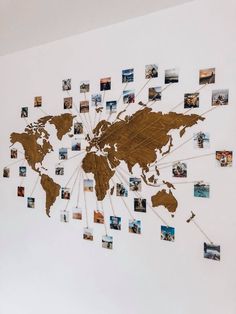 a world map made out of photos on a wall