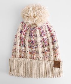 a white knitted hat with a pom - pom on the front and bottom