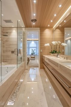 a large bathroom with two sinks and a bathtub in the middle, along with a walk - in shower