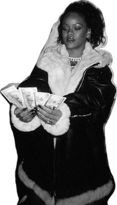 a woman in a fur coat is holding money