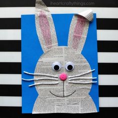 an easter bunny made out of newspaper paper on a black and white striped background with text