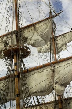 an old sailing ship with sails and masts
