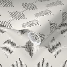 a white and black wallpaper with an abstract design on the bottom half of it