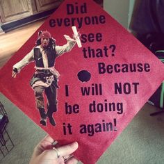 someone is holding up a red graduation cap with an image of jack sparrow on it that says did everyone see that? because i will not be doing it again