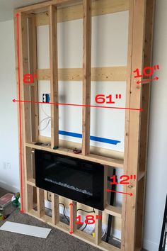 an entertainment center built into the wall with measurements to fit it in front of it