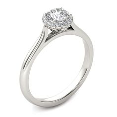 a white gold engagement ring with a round diamond