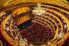 an aerial view of the auditorium at the opera royal in paris, with chandeliers hanging from the ceiling