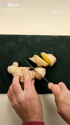 a person cutting up some food with a pair of scissors and a banana on top of it