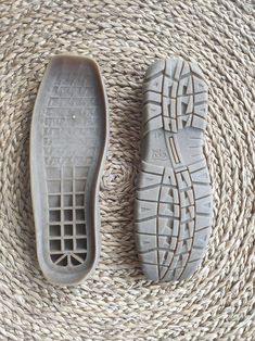 two pairs of shoes sitting on top of a wicker flooring mat next to each other