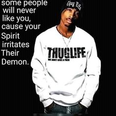 a man wearing a white sweatshirt with the words, some people will never like you cause your spirit irritates their demon