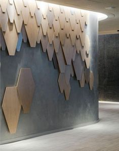 the wall is made up of wooden hexagonal shapes