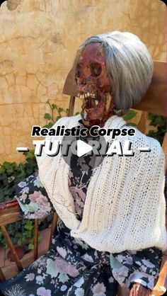 an old woman sitting in a chair with her face painted like a human head and the words realistic corpse on it