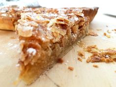 a close up of a piece of pie on a cutting board