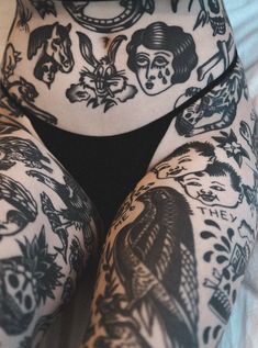 a woman's leg with tattoos on it