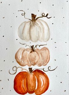 watercolor painting of pumpkins on white paper