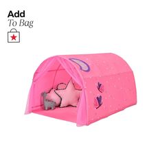 a pink tent with stars on it and a stuffed animal in the front, sitting inside