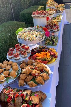 a long table filled with lots of different types of food on it's sides