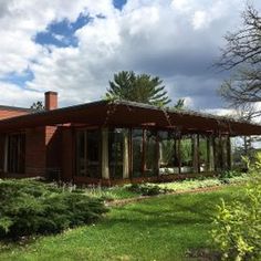 the house is made of wood and glass