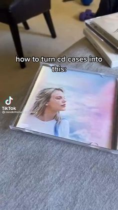 there are two cds on the floor and one has an image of a woman's face