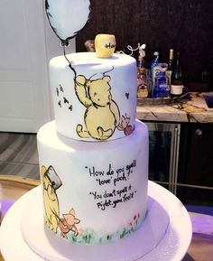 a winnie the pooh birthday cake on a table