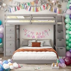 a bedroom decorated with balloons and streamers in the shape of birthday decorations, including a bunk bed