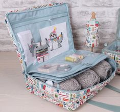 an open suitcase filled with yarn and crochet