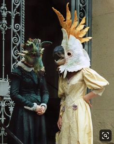 two people in costumes standing next to each other