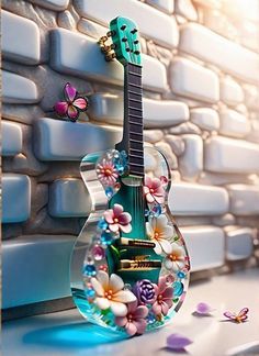 a green guitar sitting on top of a table next to a brick wall with flowers