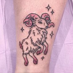 a tattoo with a ram on it's leg and stars around the legs,