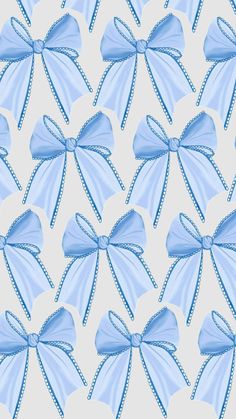 a blue bow on a white background that looks like it has been made out of fabric