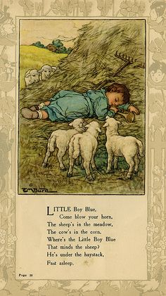 the little boy is laying down with his lambs in front of him, and there are