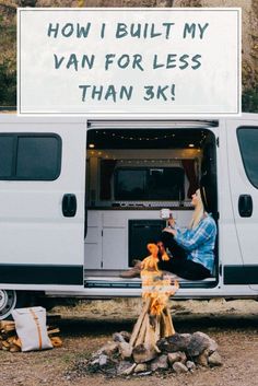 a woman sitting in the back of a van with a sign on it that says, how i built my van for less than 3k