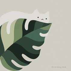 a white cat sitting on top of a green leaf with leaves around it's edges