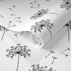 black and white wallpaper with dandelions on it