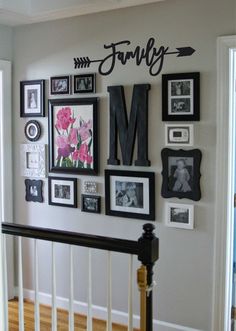 the wall is covered with many framed photos and letters that spell out mom on it